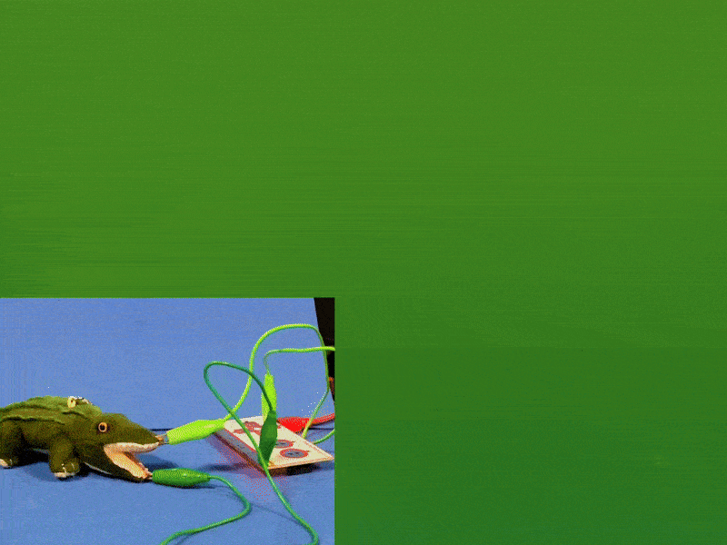 A video demo showcasing the simple alligator circuit with p5 code. When the mouth is closed, the word Chomp! is flashed on the screen with an alligator emoji.